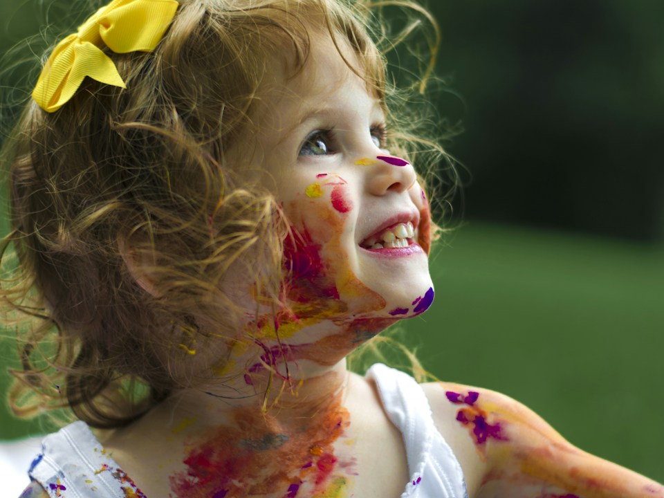 Child enjoying an outdoor activity, stock photograph